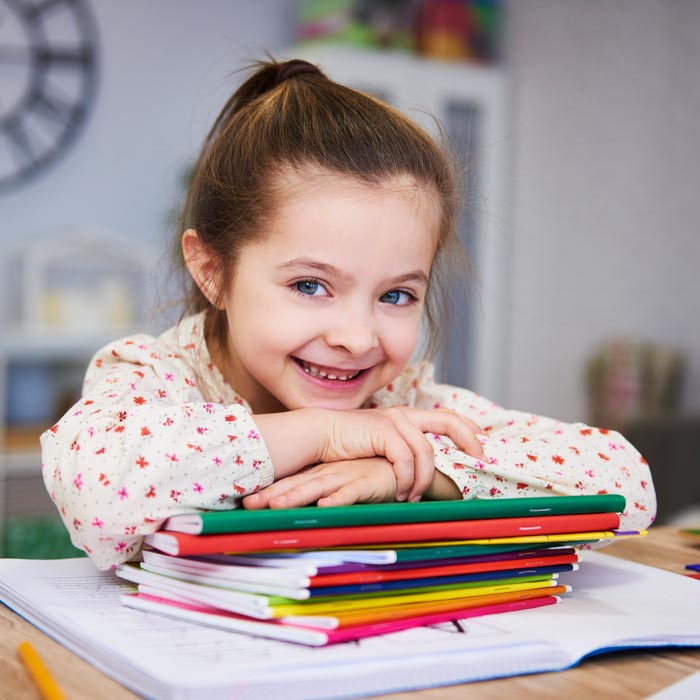 smiling girl studying home sq